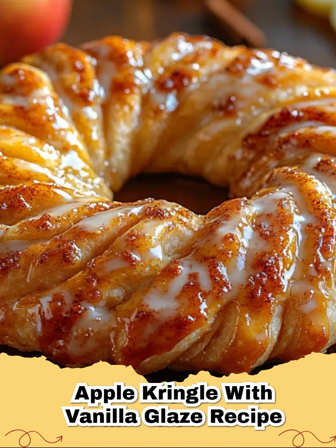 Golden brown Apple Kringle with Vanilla Glaze sliced on a wooden board