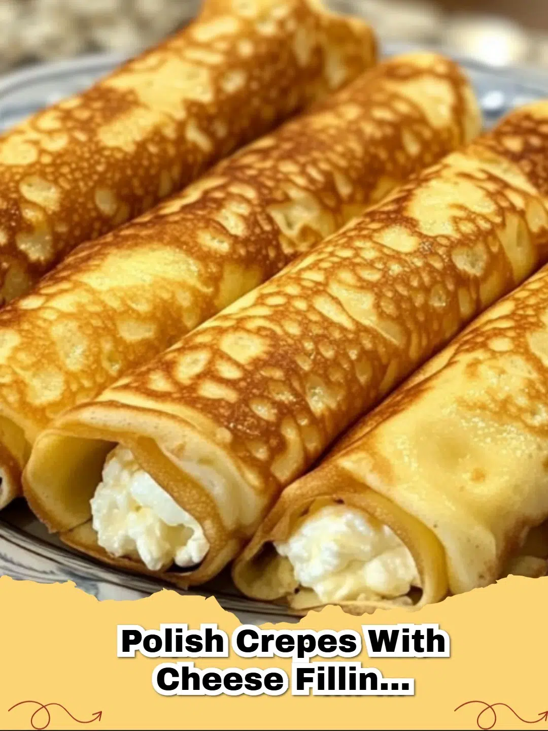 Golden Polish Crepes with Cheese Filling (Naleśniki Recipe) dusted with powdered sugar and served with berries.