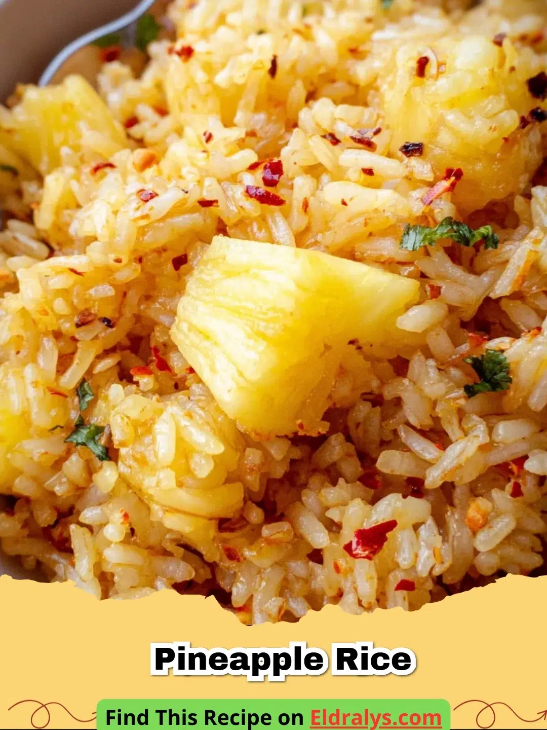 A delicious bowl of golden Pineapple Rice served in a hollowed-out pineapple boat with cashews and cilantro.