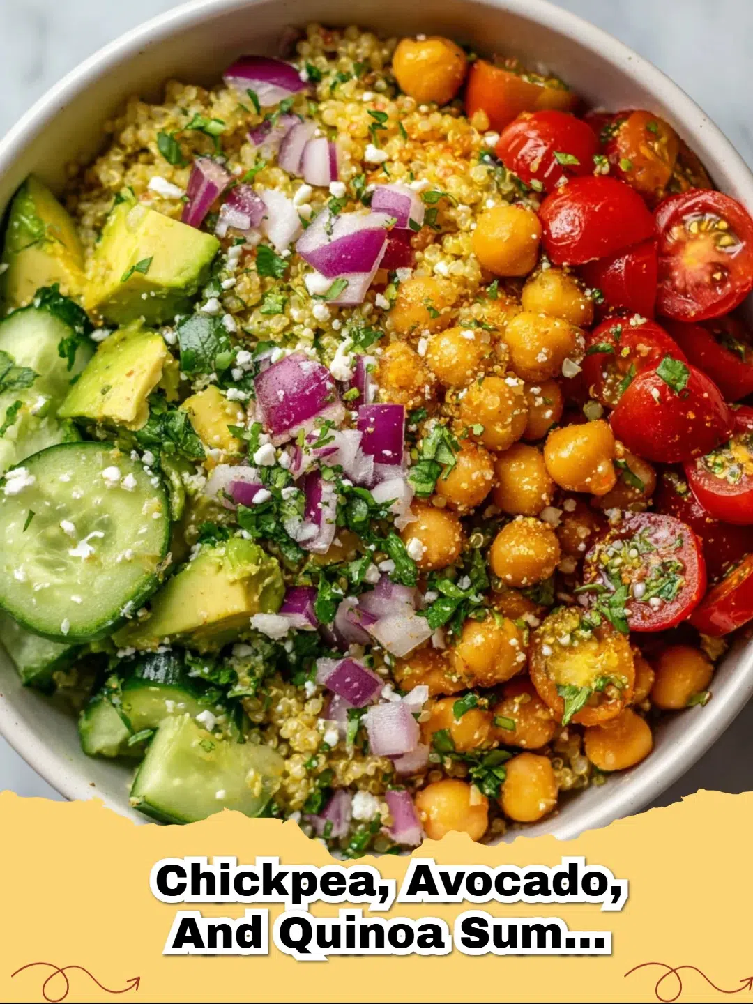 A vibrant Chickpea Quinoa Power Bowl in a white ceramic dish, featuring colorful vegetables and fresh herbs.