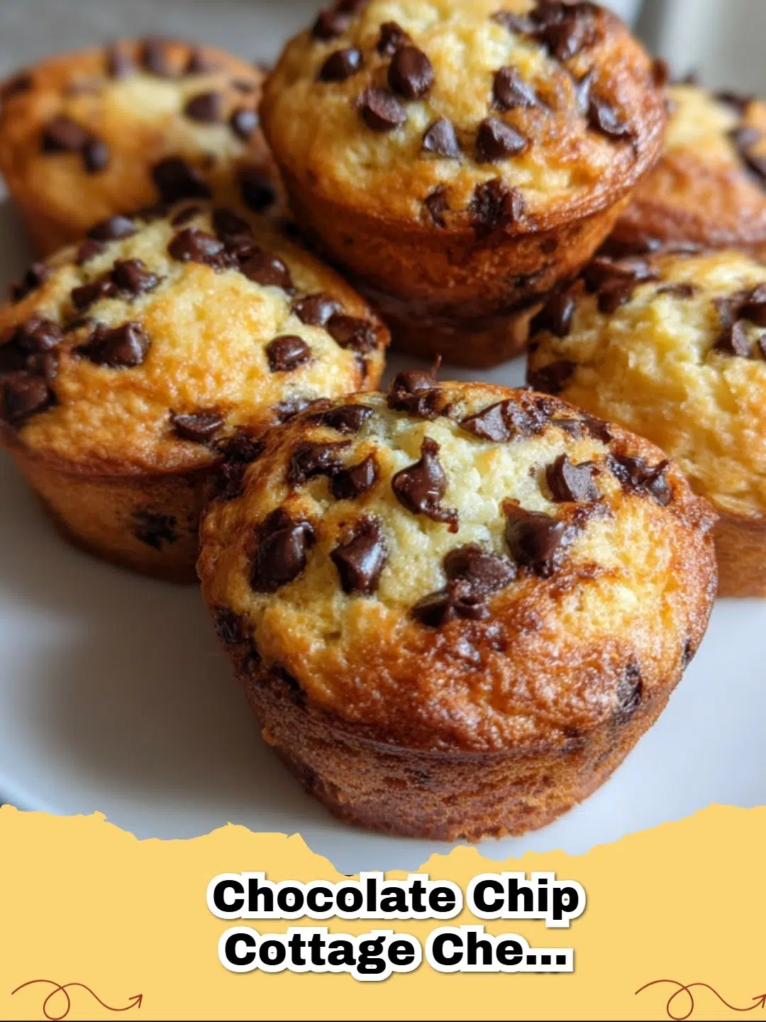 Batch of Chocolate Chip Cottage Cheese Protein Muffins on a cooling rack