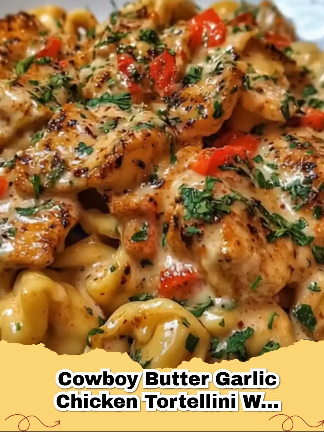 A close up shot of Cowboy Butter Garlic Chicken Tortellini with Fire-Roasted Red Peppers in a cast iron skillet.