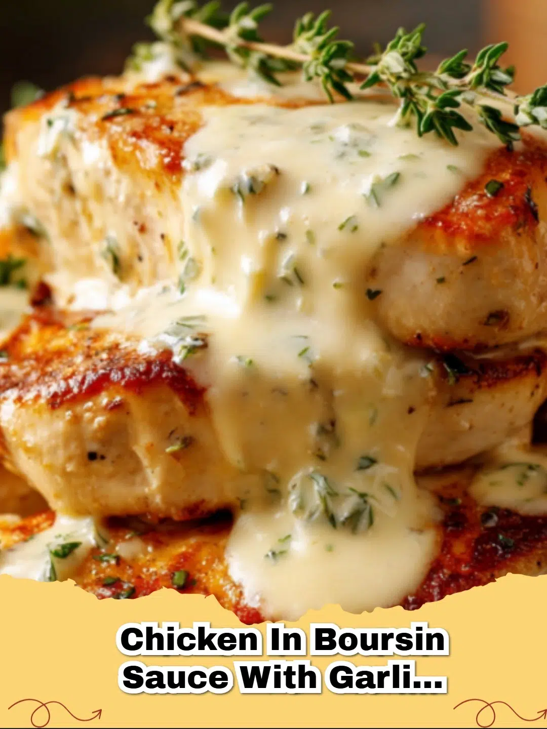 Creamy Garlic Boursin Chicken served with pasta and fresh herbs on a white plate.