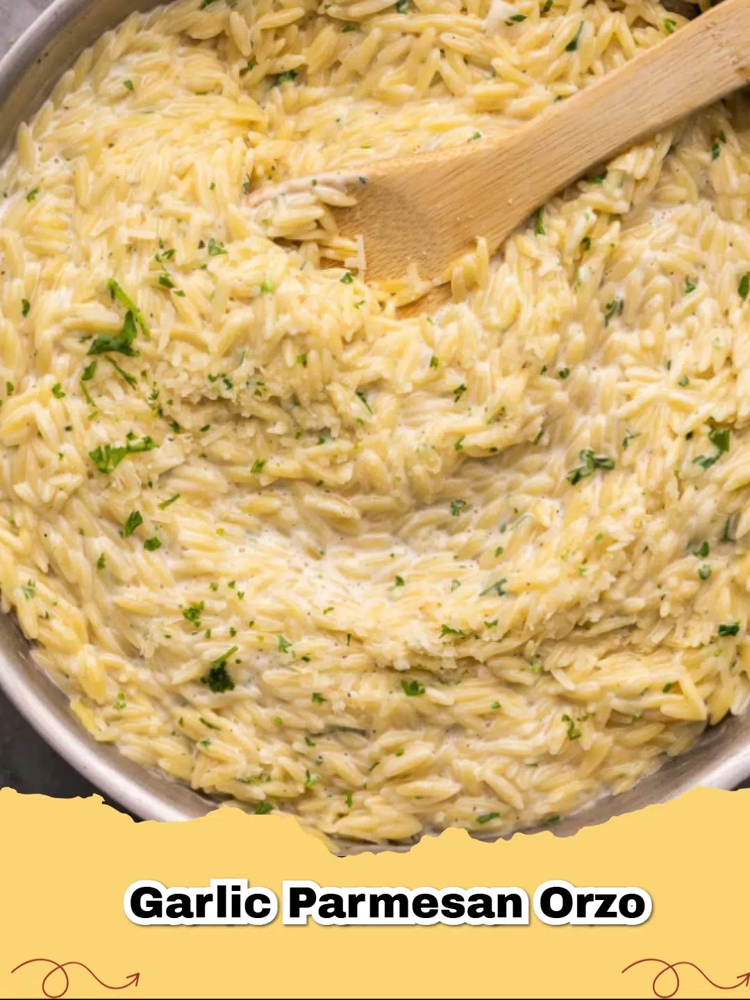 A close-up of Creamy Garlic Parmesan Orzo topped with fresh parsley in a white bowl.