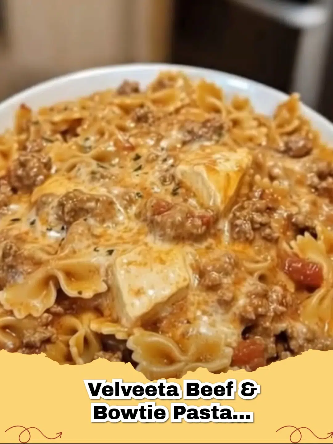 A close up bowl of Creamy Velveeta Beef and Bowtie Pasta with melted cheese sauce.