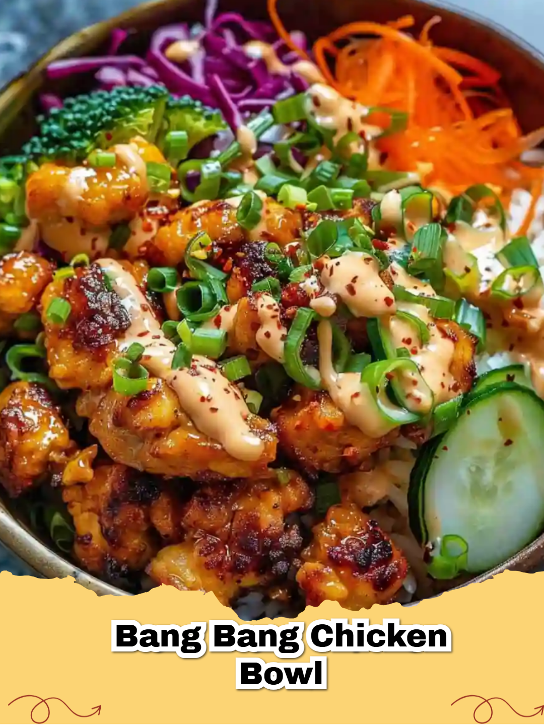 A delicious and colorful Crispy Bang Bang Chicken Bowl with fresh vegetables and jasmine rice.