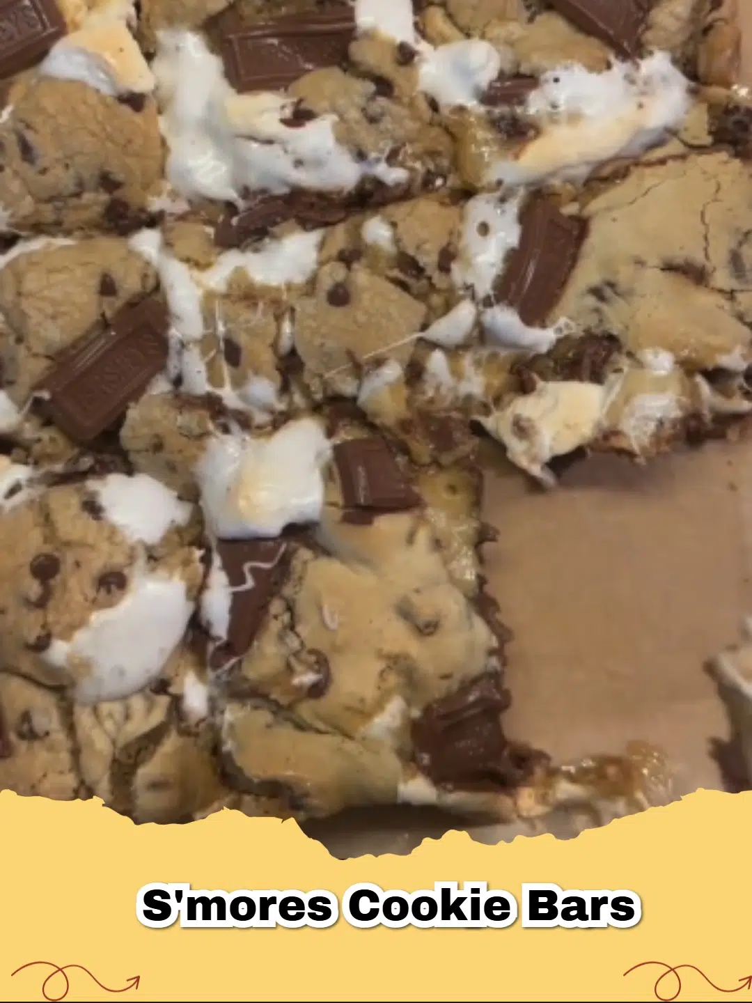 A close up view of Easy S'mores Cookie Bars showing melted chocolate and toasted marshmallows.
