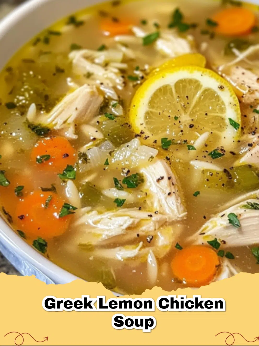 A steaming bowl of Greek Lemon Chicken Orzo Soup with fresh parsley and lemon slices.