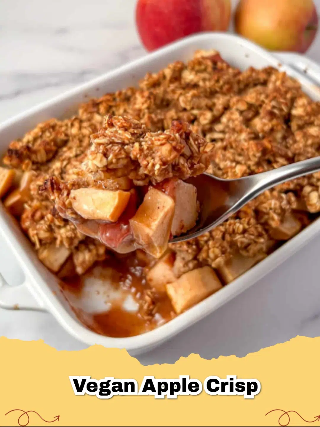 A warm dish of Healthy Vegan Apple Crisp with a golden oat and walnut topping.