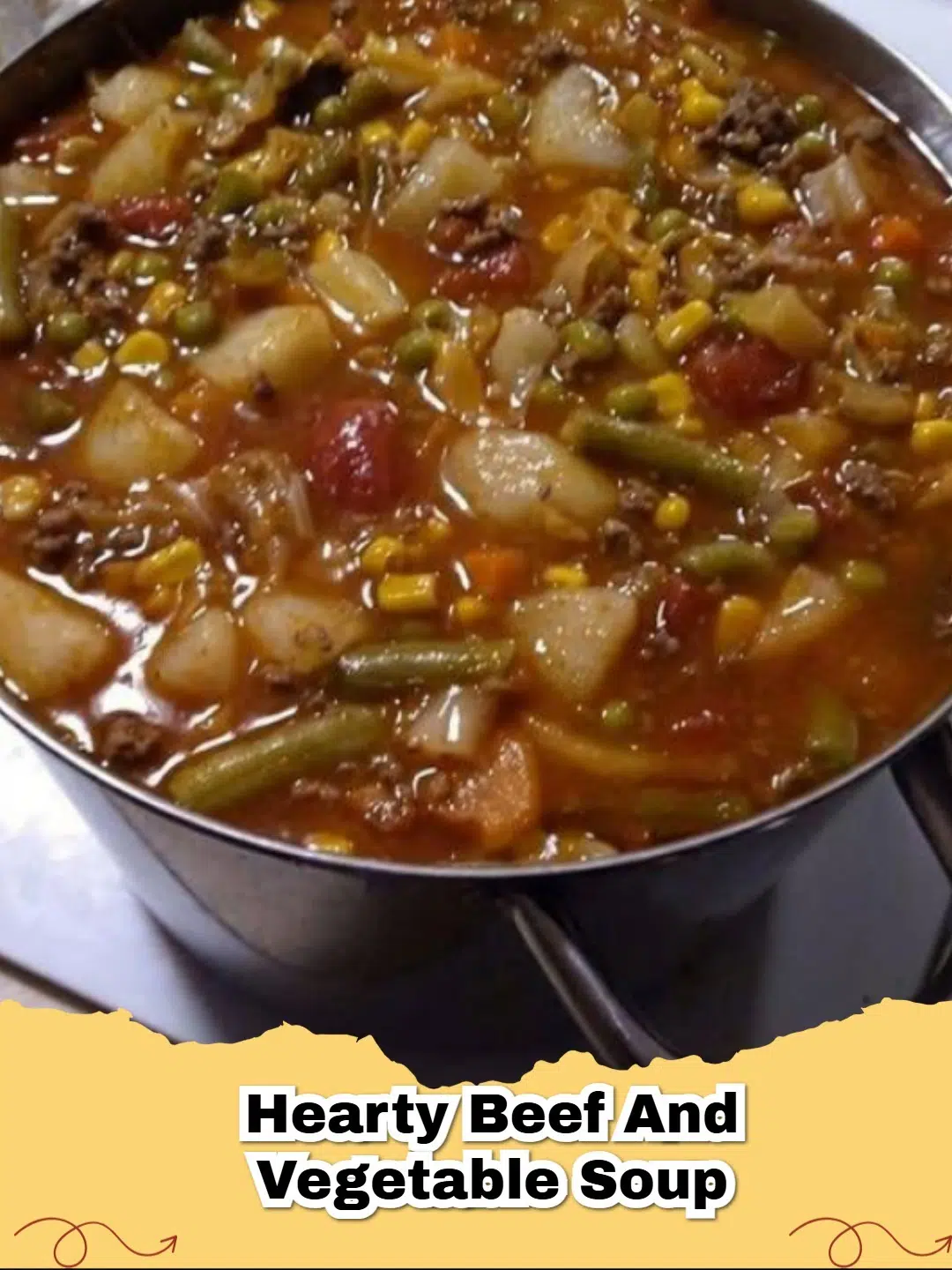A steaming bowl of hearty beef and vegetable soup with crusty bread, perfect for comfort.