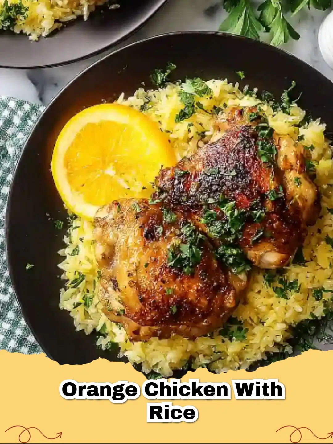 Honey Orange Chicken Thighs with Rice in a cast iron skillet with fresh orange slices and parsley garnish.