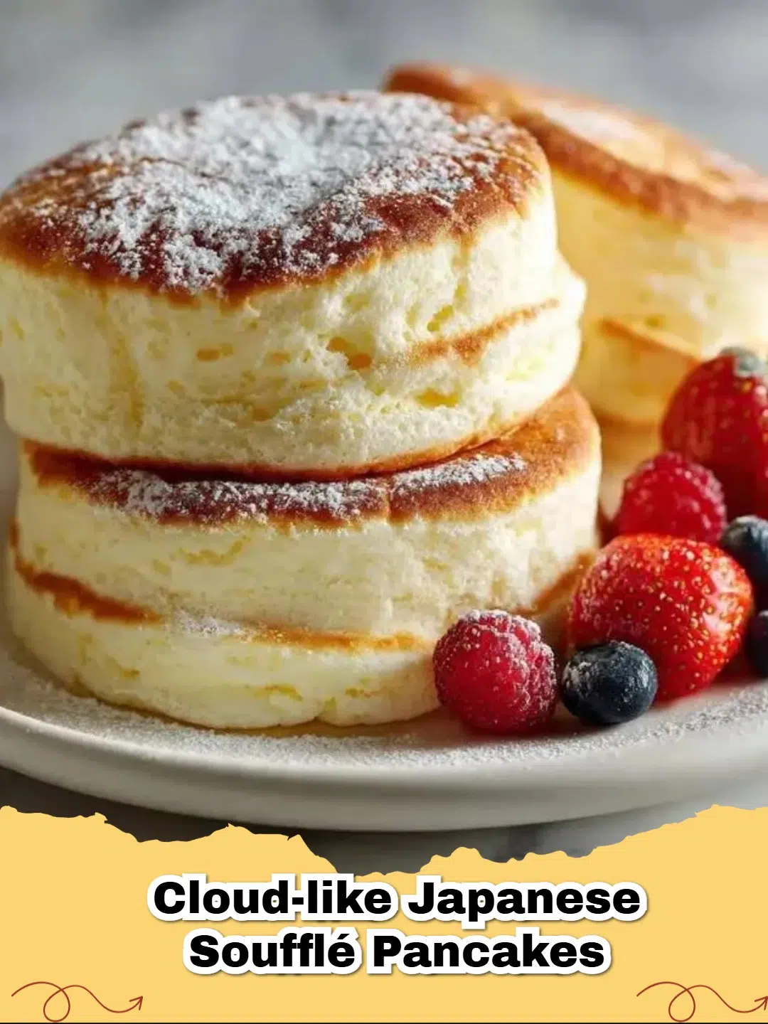 A stack of towering Cloud-Like Japanese Soufflé Pancakes topped with butter and syrup