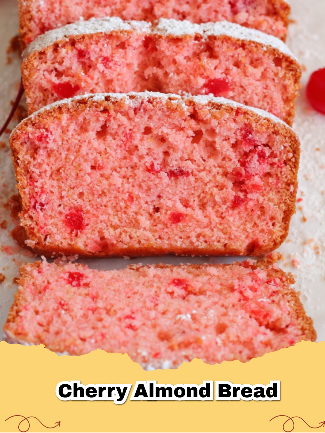 A close up slice of moist Maraschino Cherry Almond Bread with pink cherry pieces.