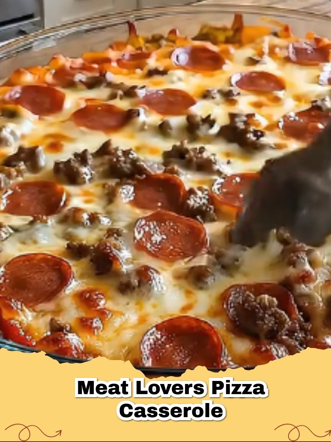 A close-up shot of Meat Lovers Pizza Pasta Bake in a baking dish with melted cheese and pepperoni on top.