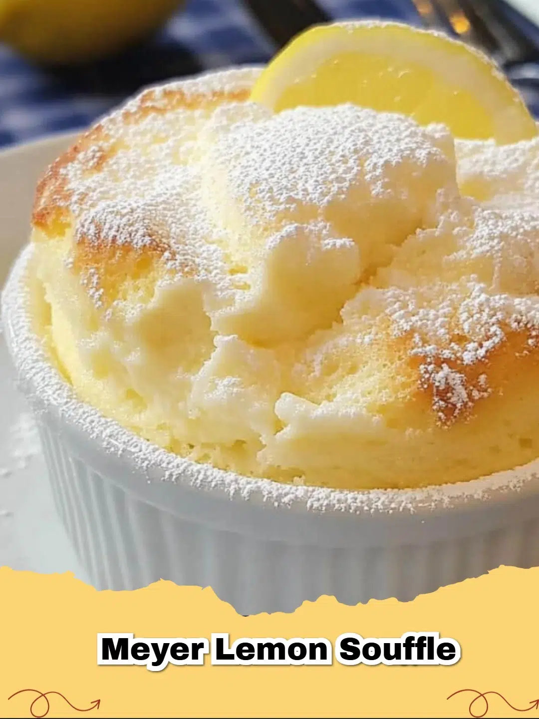 A towering, golden Meyer Lemon Soufflé Recipe served in a white ceramic ramekin.
