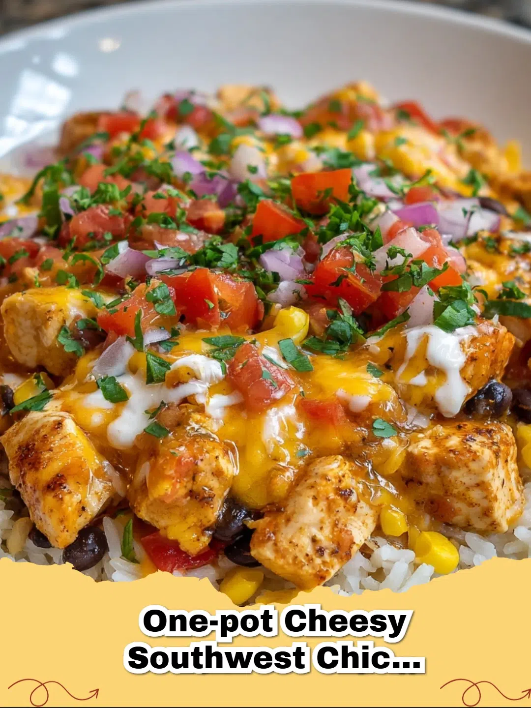 One-Pot Cheesy Southwest Chicken and Rice skillet with melted cheese and cilantro