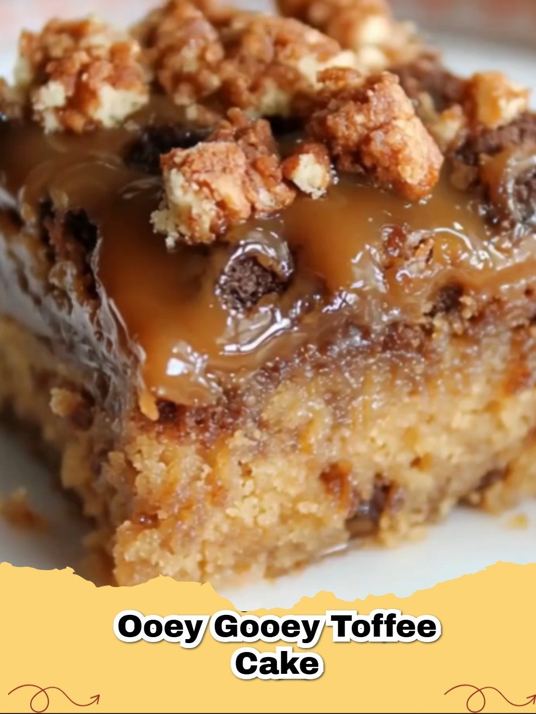 A close up of a slice of Ooey Gooey Toffee Cake with melting caramel toffee bits.