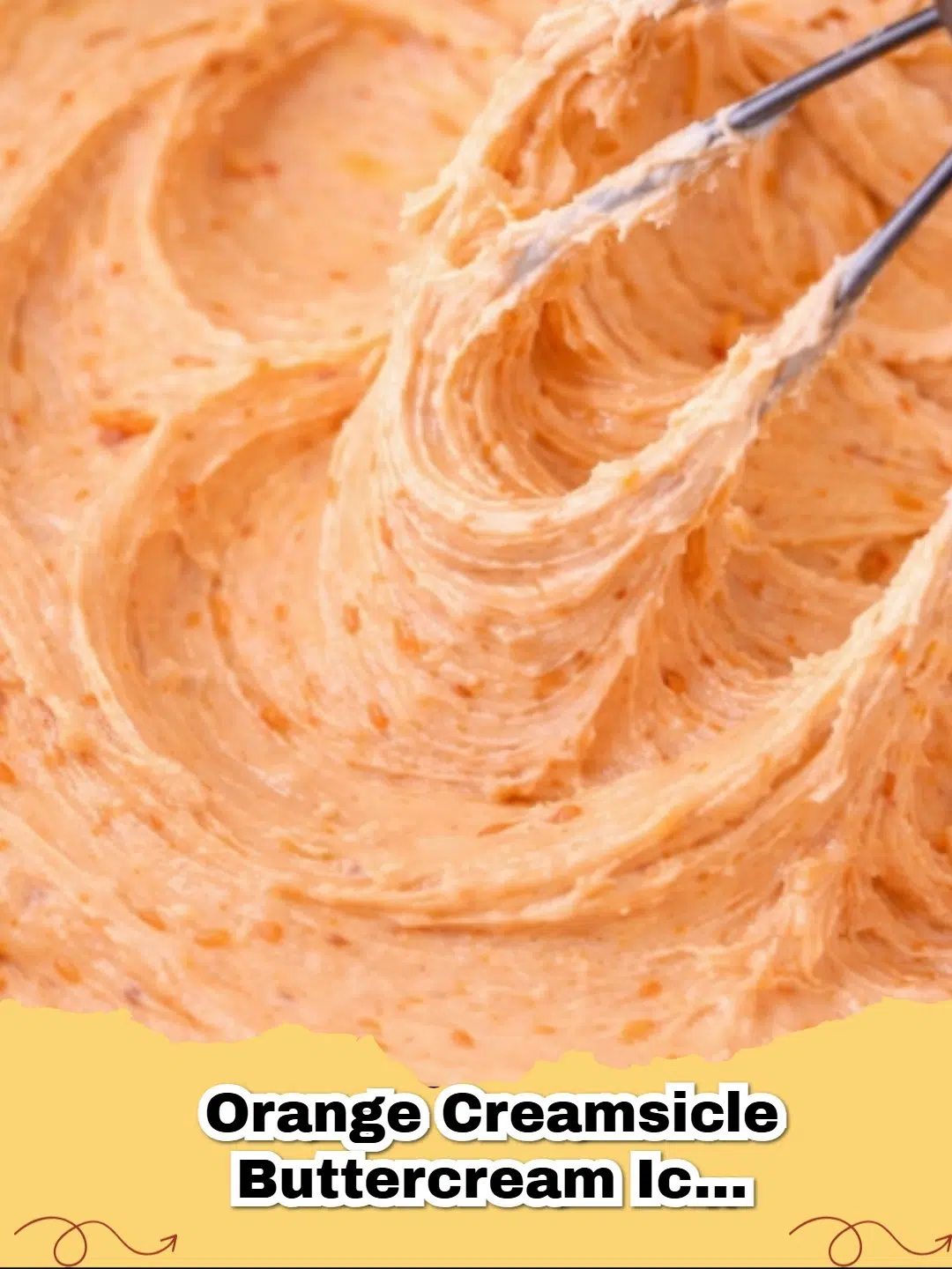 Fluffy orange creamsicle buttercream icing swirled on cupcakes, with fresh orange zest garnish.