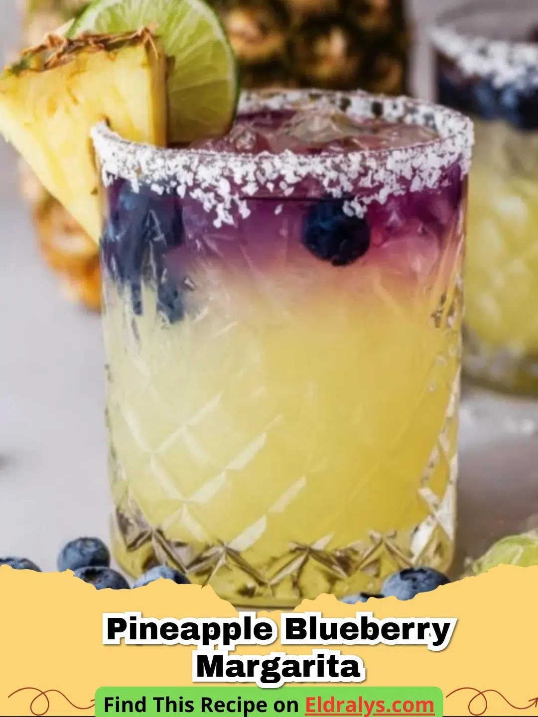 A vibrant purple and yellow Pineapple Blueberry Margarita garnished with fresh fruit.