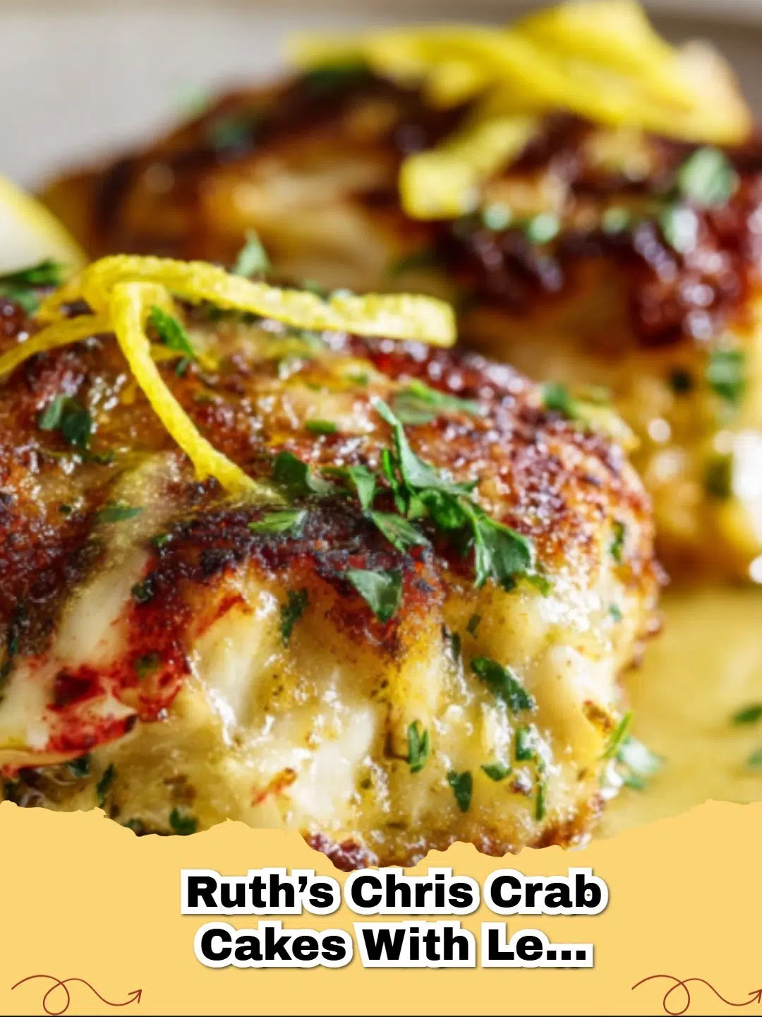 Platter of golden-brown Ruth's Chris style crab cakes drizzled with lemon butter sauce, garnished with fresh parsley.