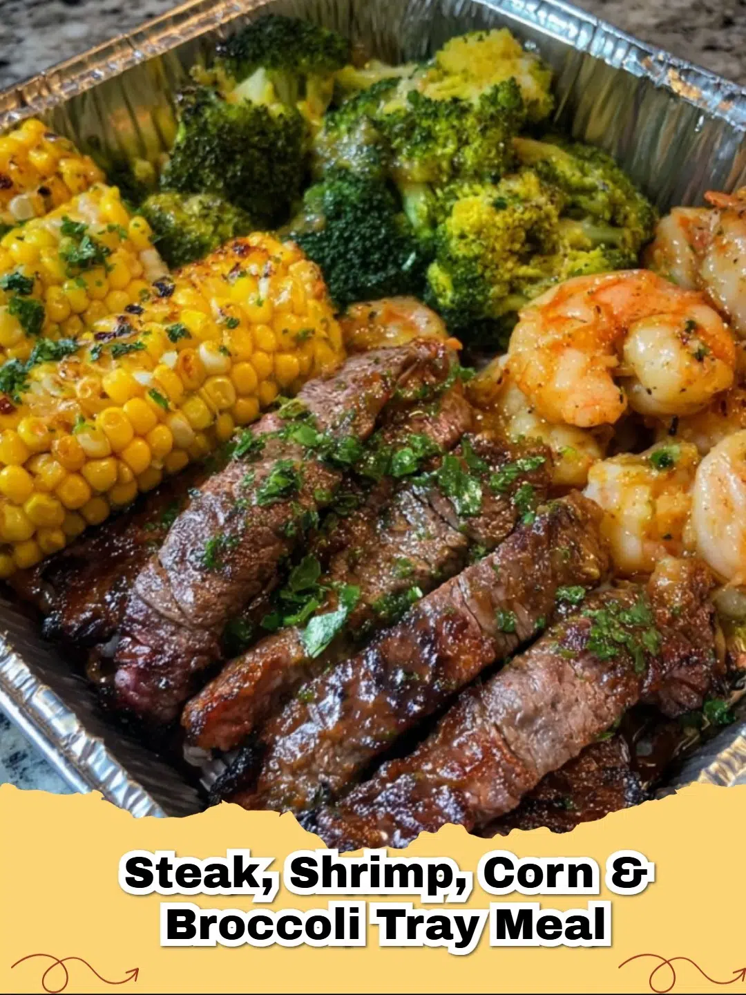 Steak, Shrimp, Corn and Broccoli Sheet Pan Dinner served on a baking sheet with fresh parsley garnish
