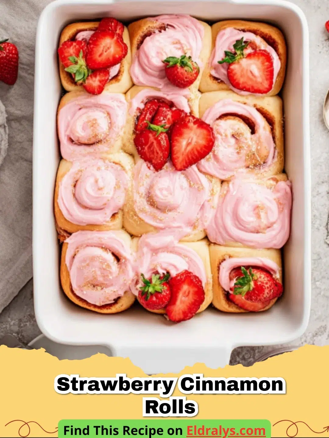 Close up of Strawberry Cinnamon Rolls with Cream Cheese Glaze in a baking pan