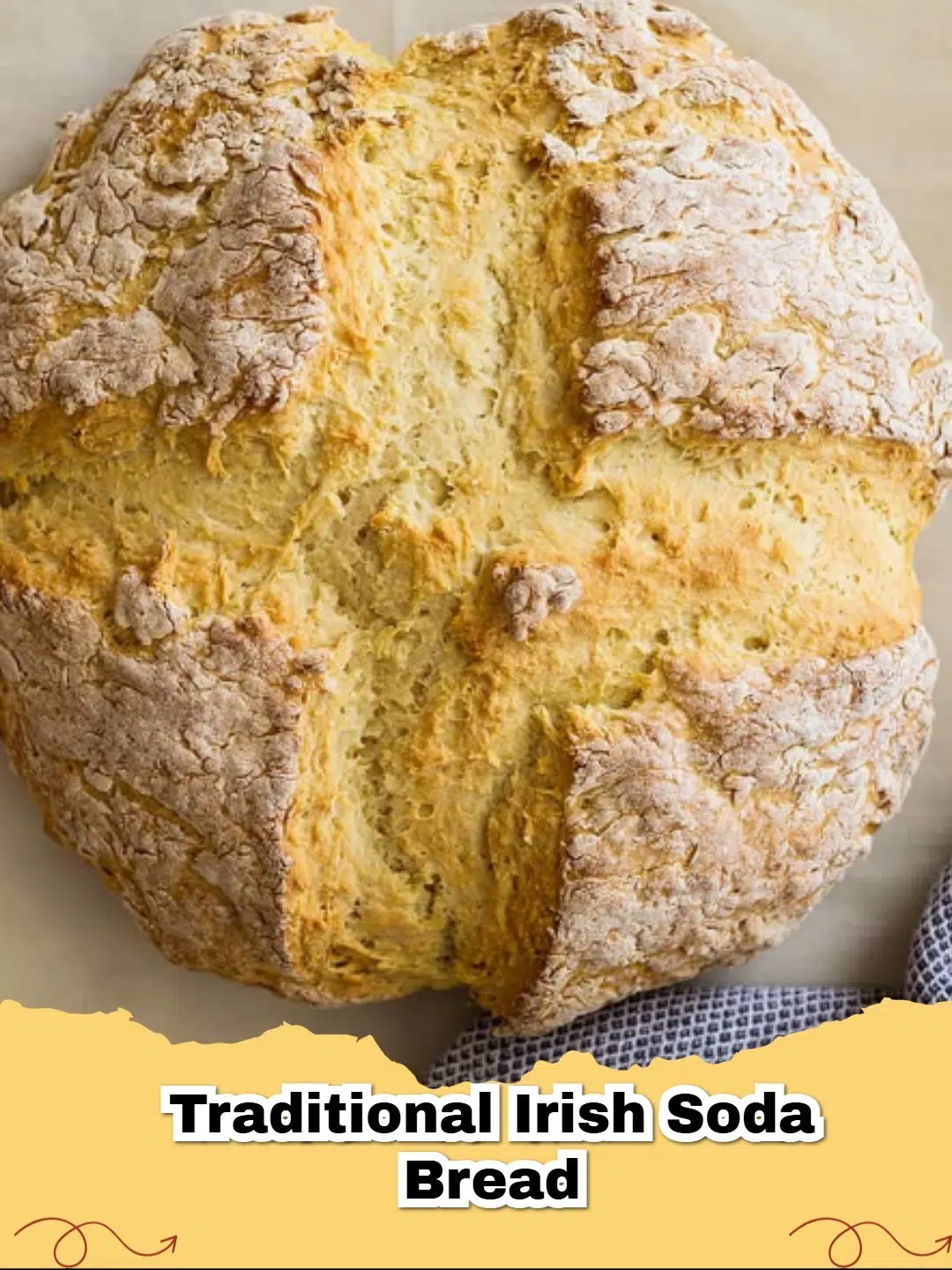 A rustic loaf of Traditional Irish Soda Bread on a floured wooden surface