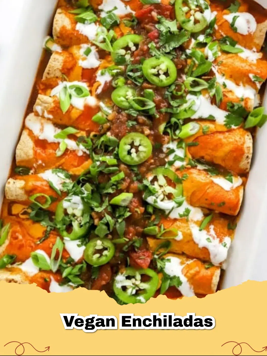 A tray of freshly baked Vegan Enchiladas topped with melted cheese and cilantro.
