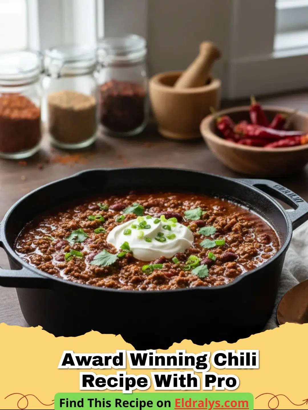 A steaming bowl of Award Winning Chili Recipe With Pro toppings like cheddar cheese and sour cream.