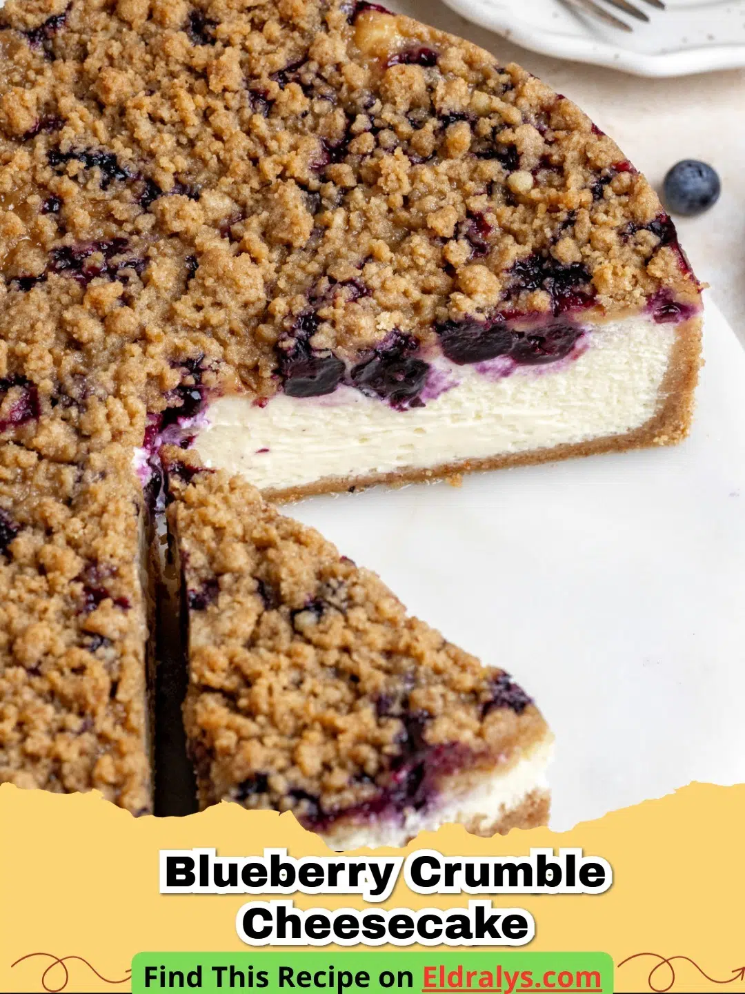 A slice of Blueberry Crumble Cheesecake with a thick crust and golden crumble topping.