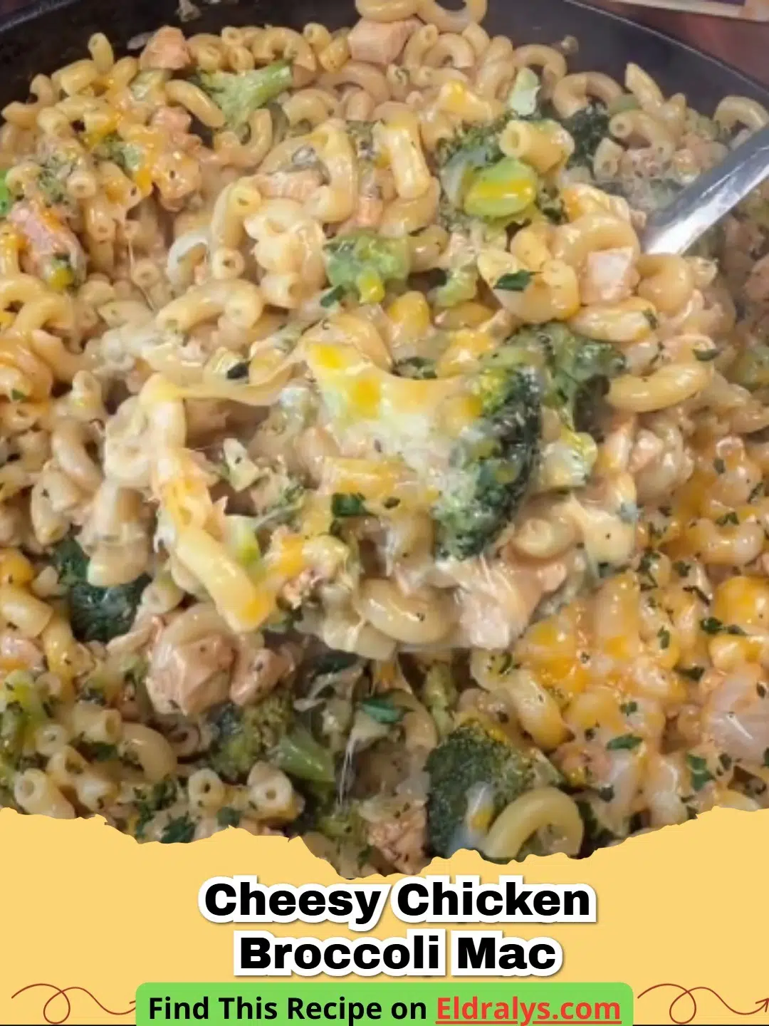 A close-up shot of a bubbling Cheesy Chicken Broccoli Mac casserole in a white ceramic dish.