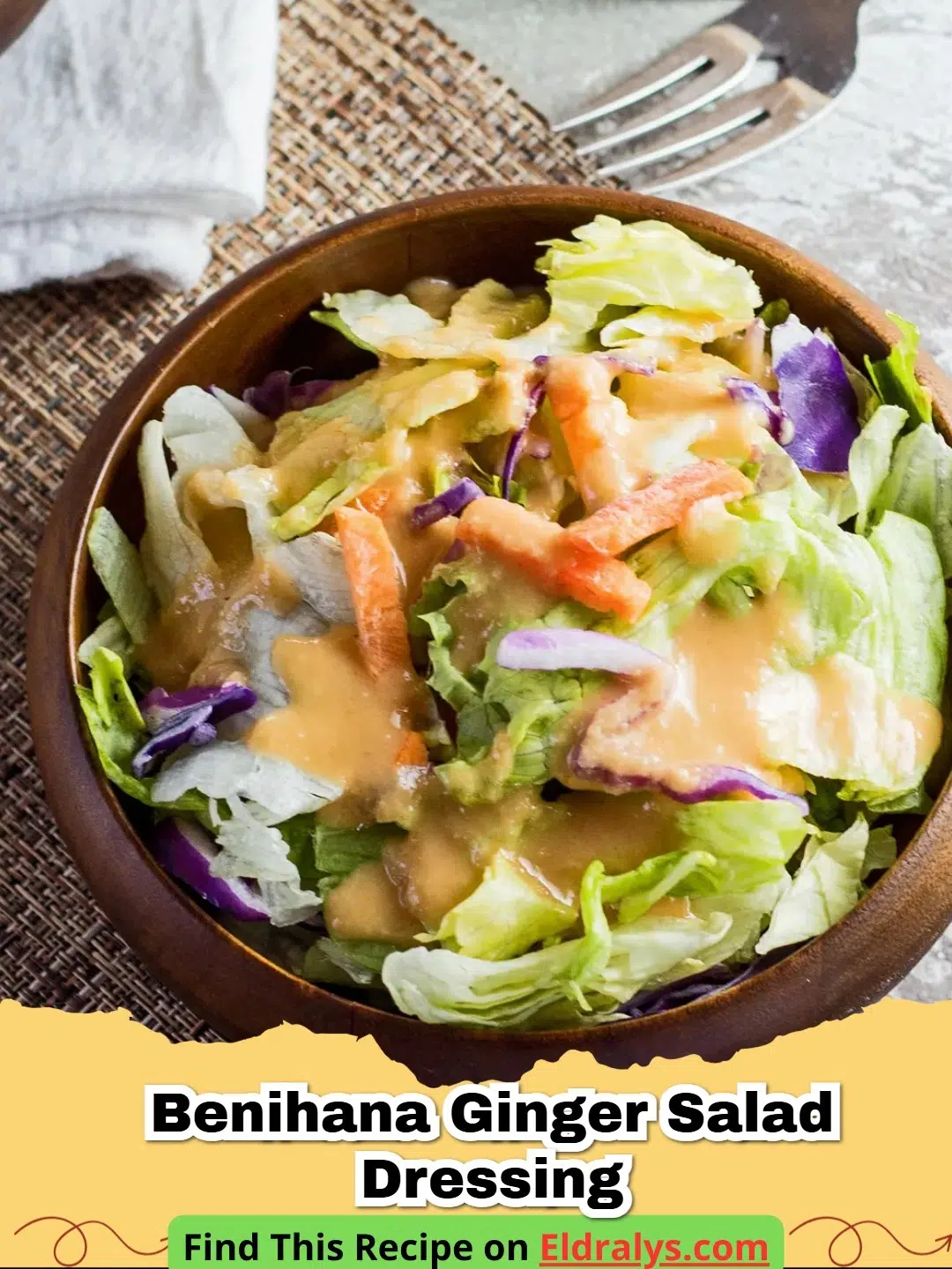 A close up shot of a glass jar filled with fresh orange-colored Copycat Benihana Ginger Salad Dressing on a wooden table.