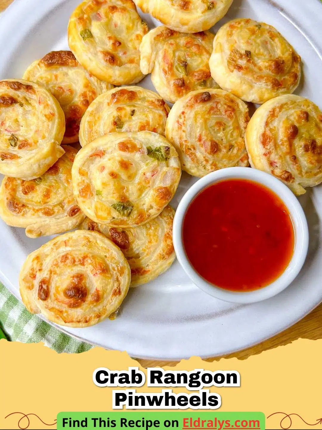 Golden brown Crab Rangoon Pinwheels served on a white platter with a side of sweet chili sauce.