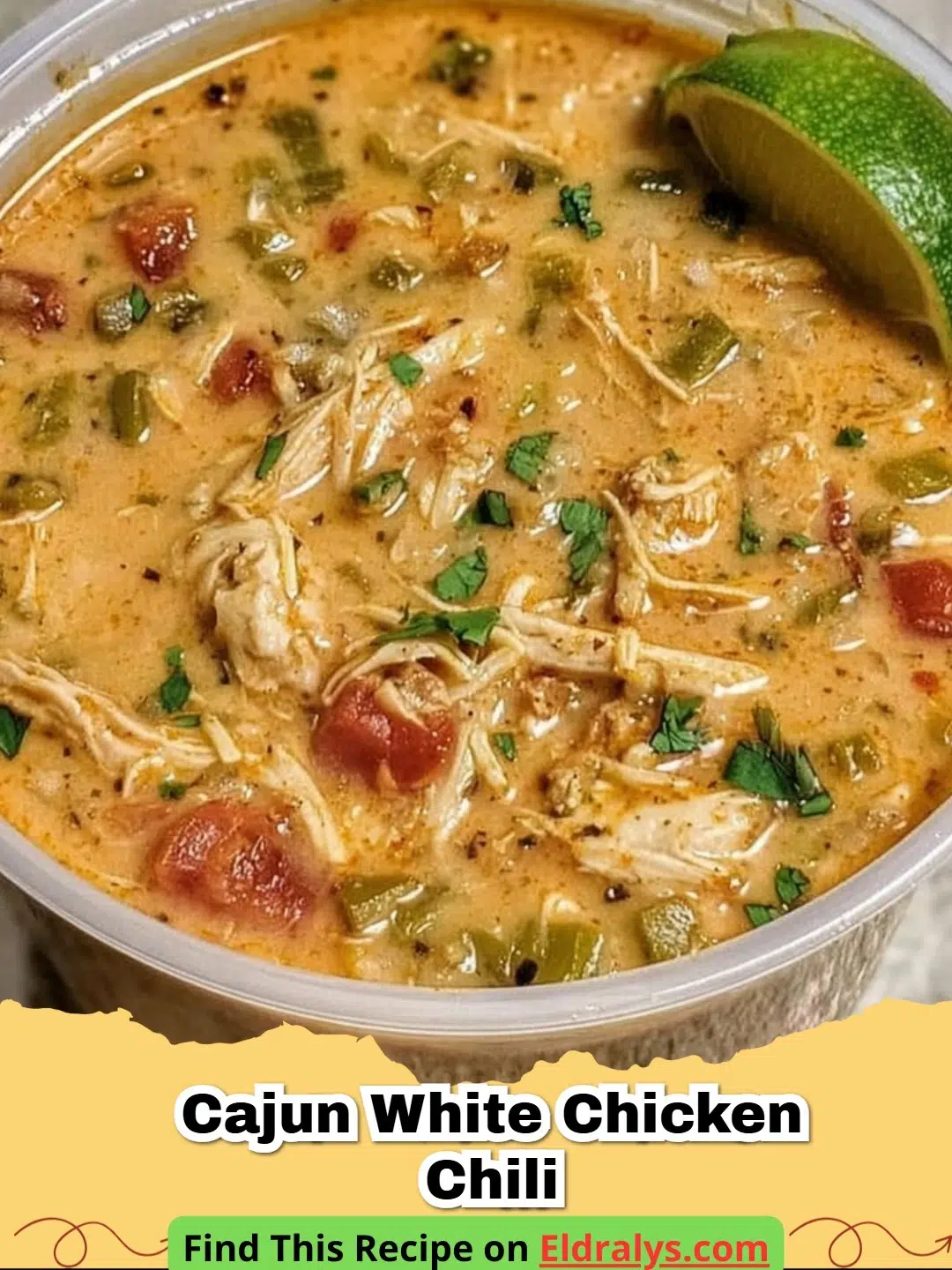 A bowl of Creamy Cajun White Chicken Chili garnished with cilantro and lime.