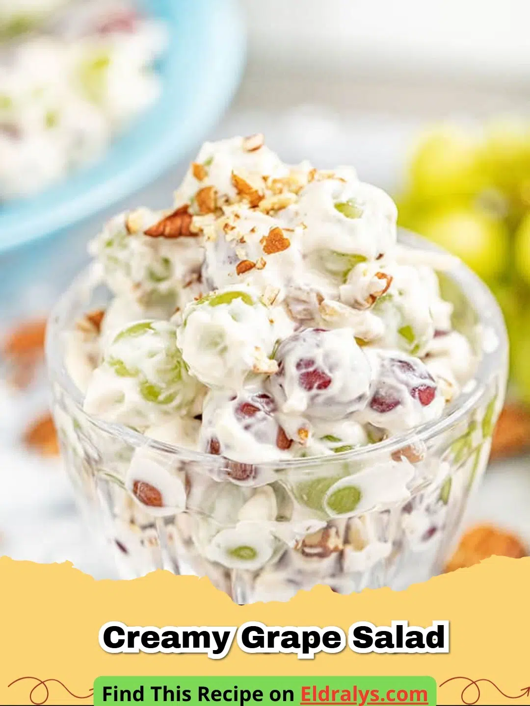 A large glass bowl filled with Creamy Grape Salad topped with brown sugar and pecans.