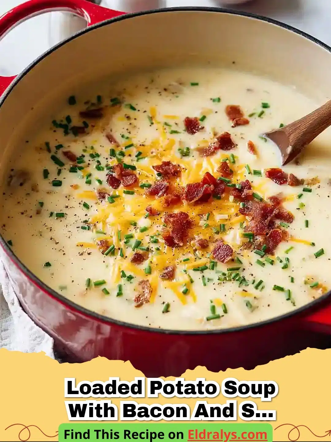 A bowl of Creamy Loaded Potato Soup with Bacon and Cheddar garnished with chives