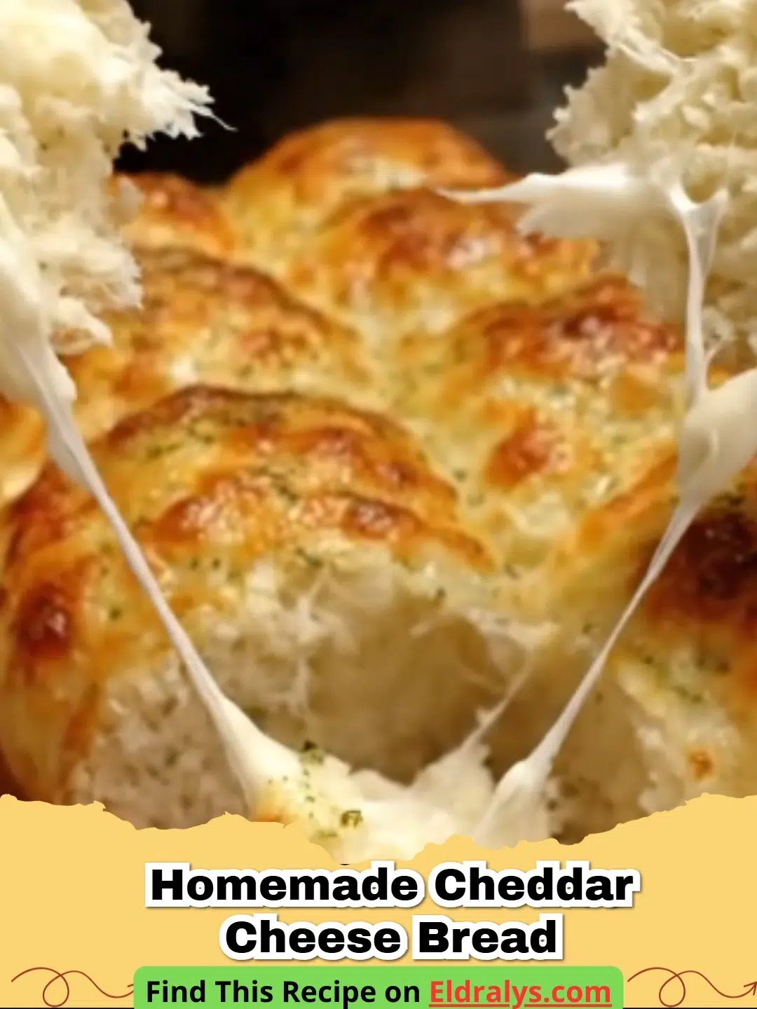 Golden brown loaf of Easy Homemade Cheddar Cheese Bread Recipe sliced on a wooden board