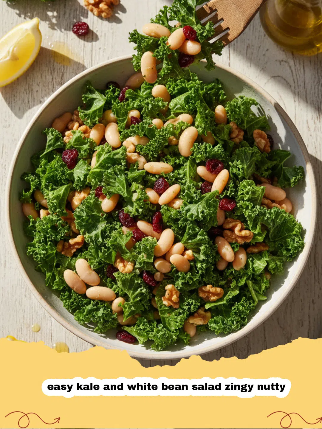 easy kale and white bean salad zingy nutty - A vibrant green kale salad with white beans and toasted nuts in a wooden bowl.