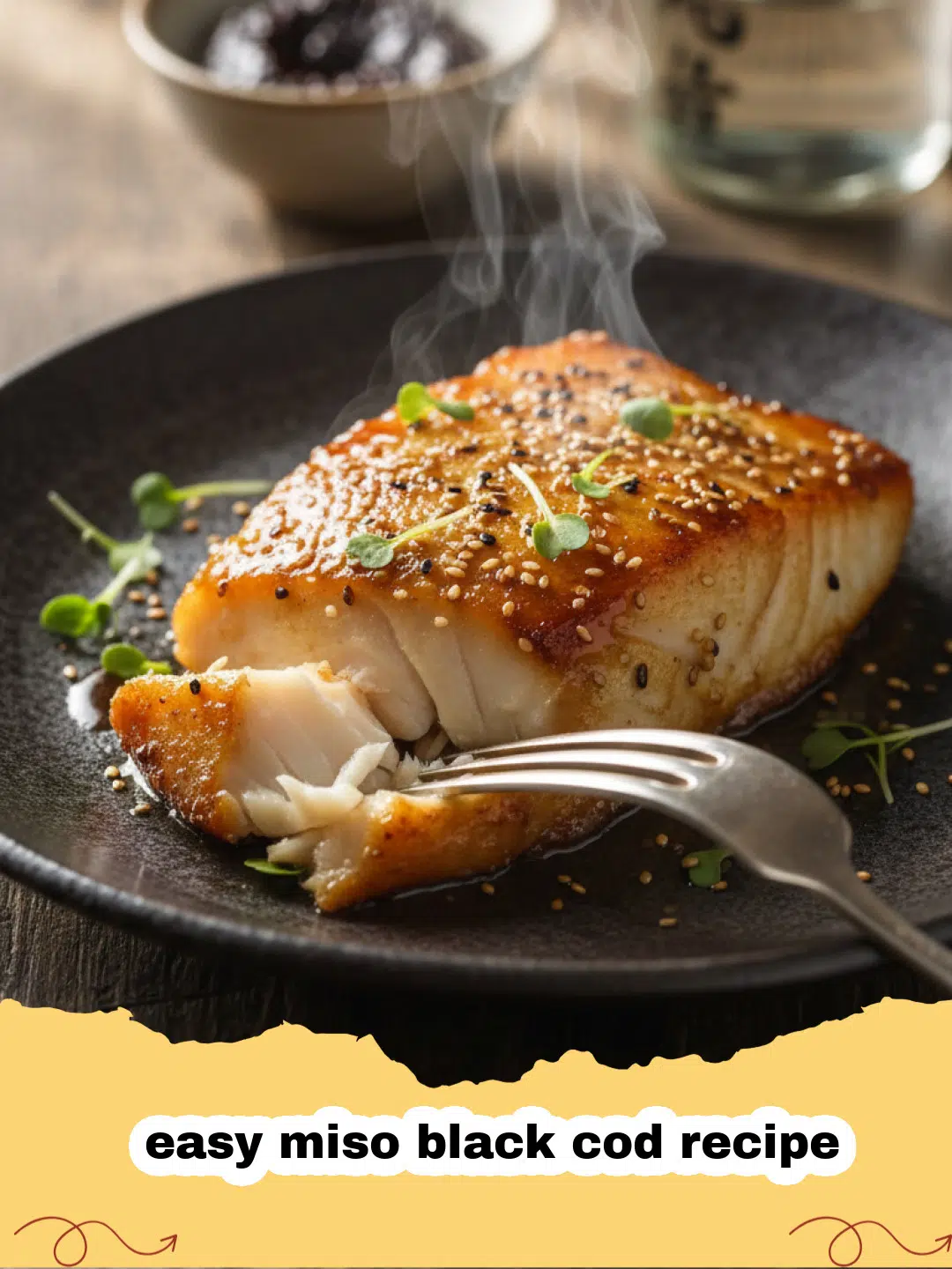 easy miso black cod recipe - A close up of glazed miso black cod on a white plate with green onions