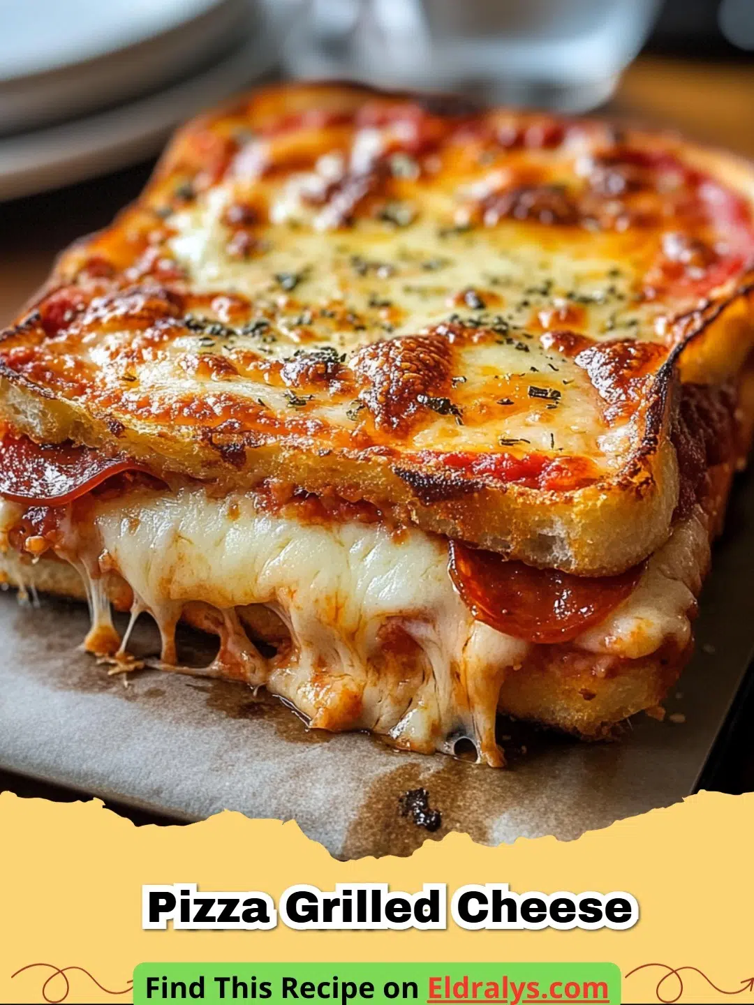 A close up of an Easy Pizza Grilled Cheese Sandwich with melting mozzarella and pepperoni showing through the center.