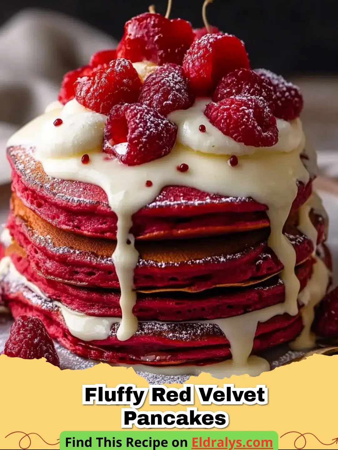 A tall stack of Fluffy Red Velvet Pancakes topped with cream cheese glaze and fresh raspberries.