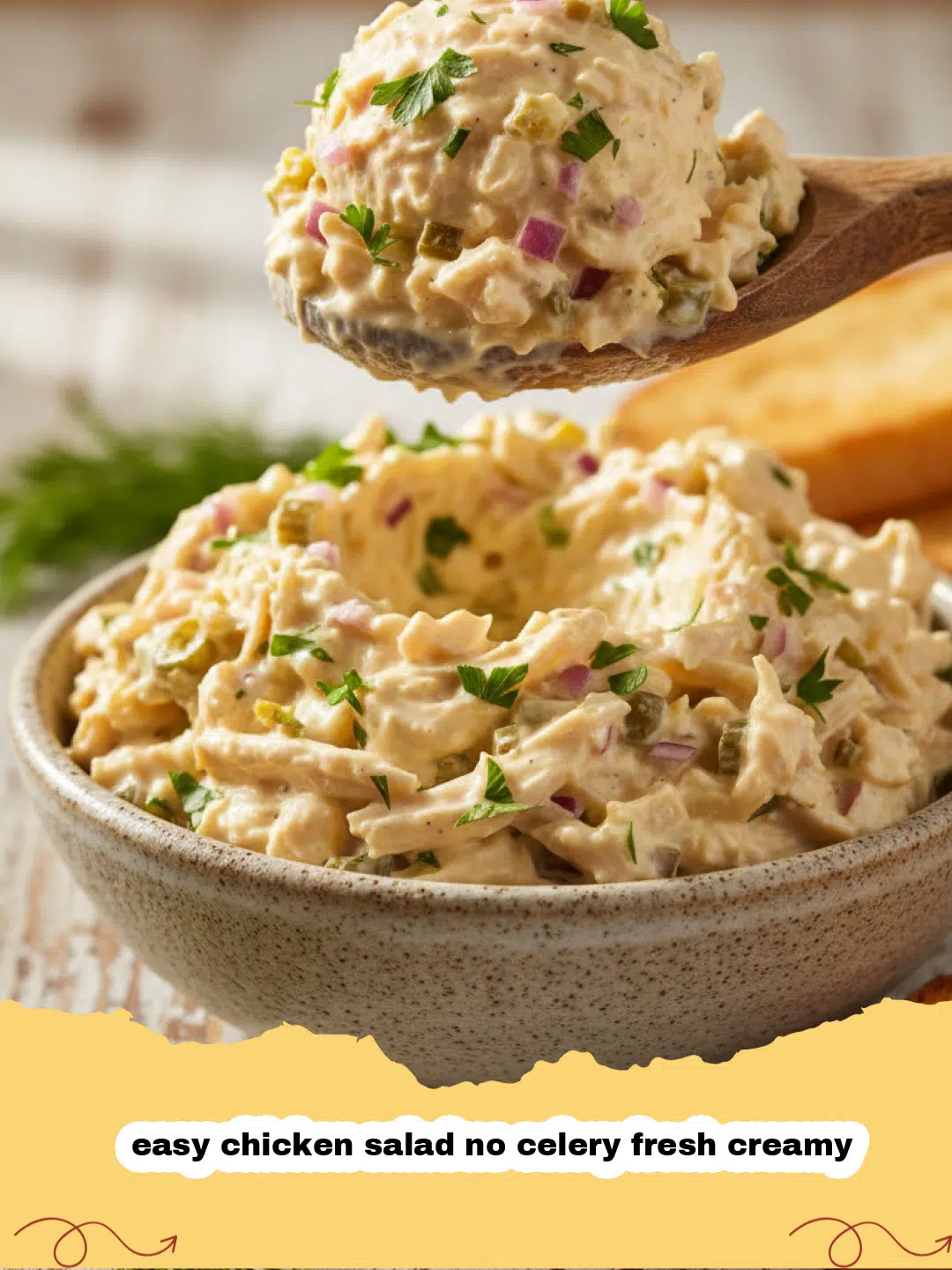 easy chicken salad no celery fresh creamy - A close-up shot of creamy chicken salad without celery, garnished with fresh dill in a white bowl.