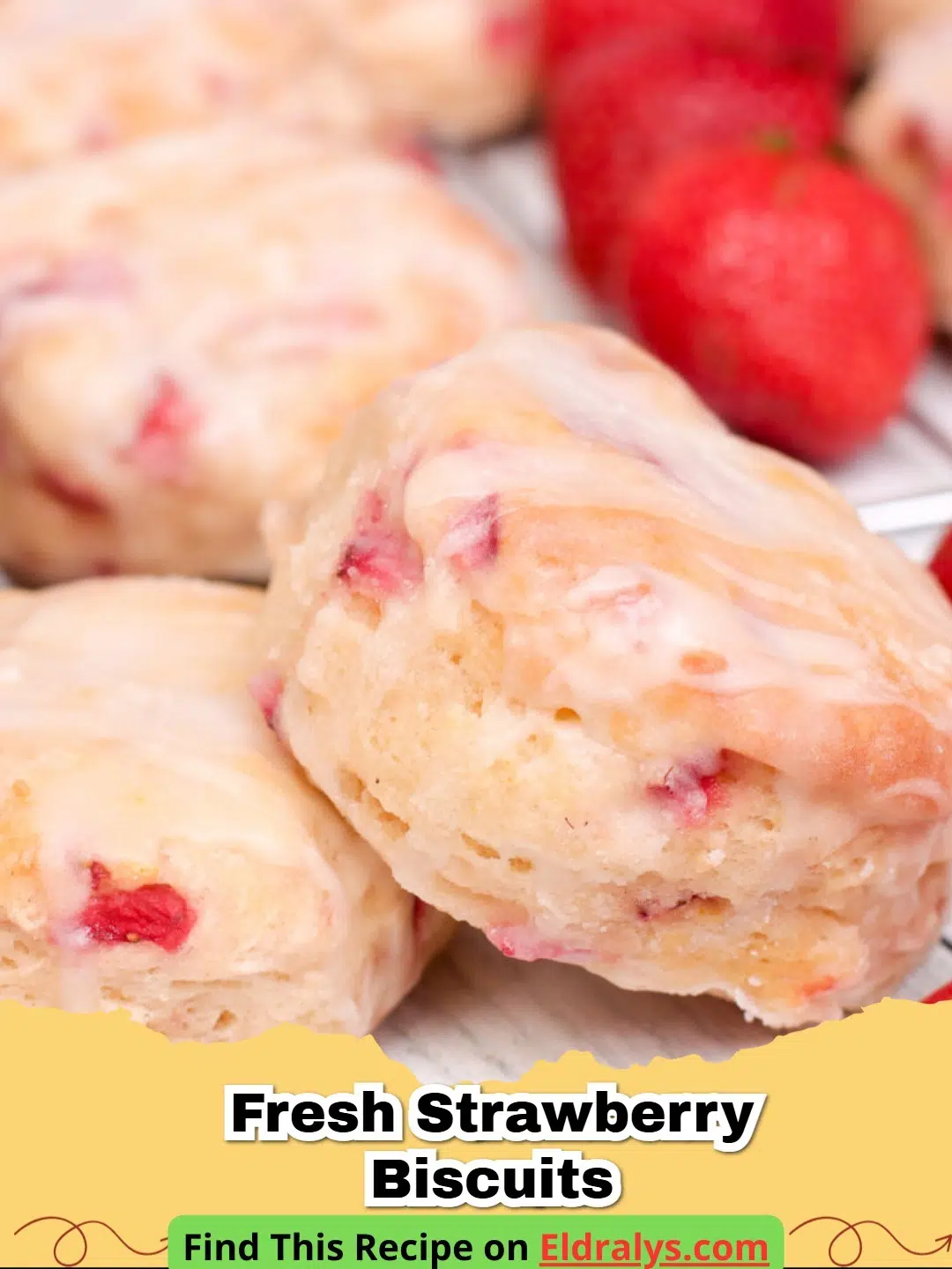 Fresh Strawberry Biscuits on a cooling rack showing flaky layers and red berry pieces