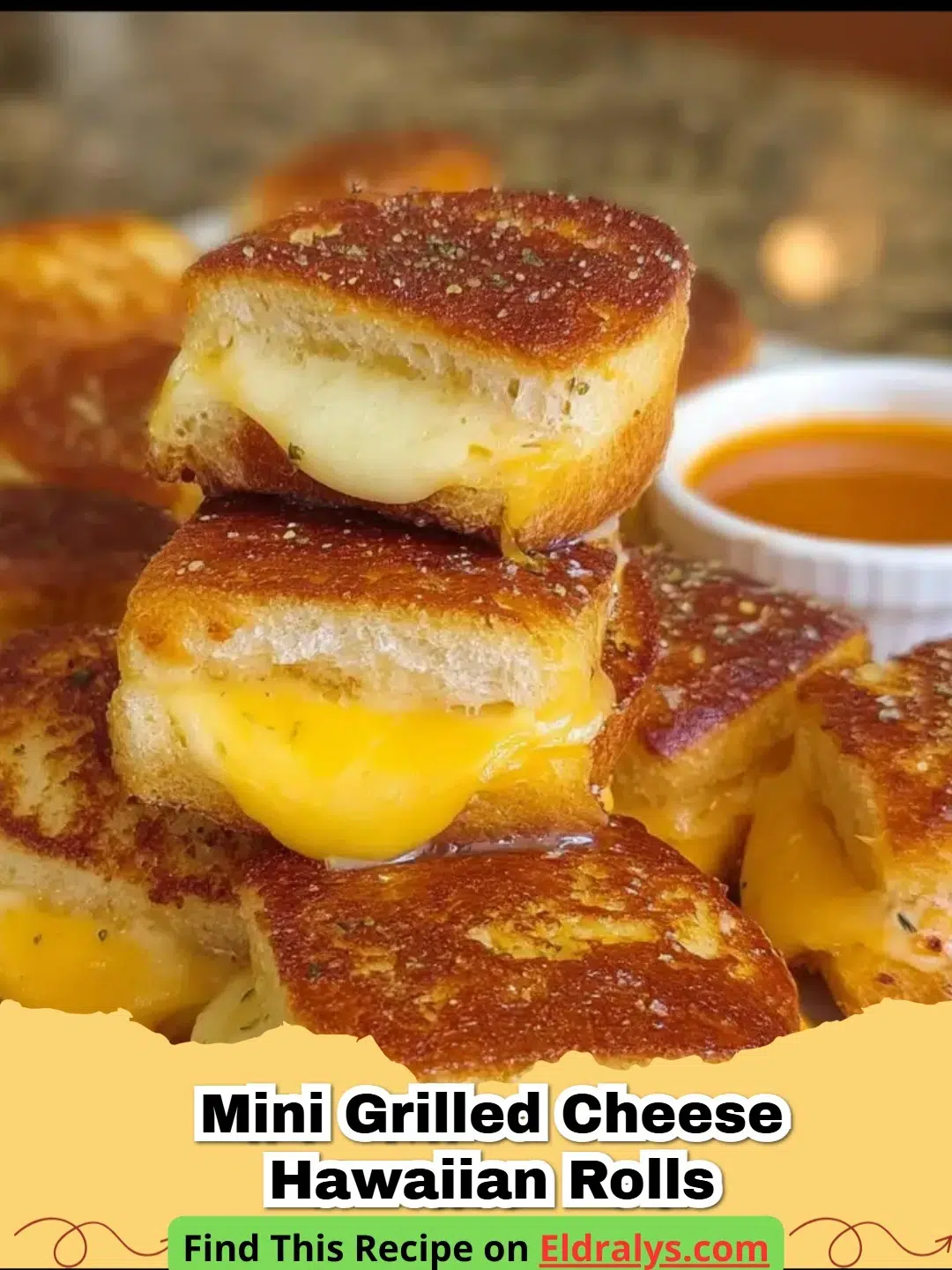 A tray of golden brown Hawaiian Roll Grilled Cheese Sliders with melted cheese pulling apart.