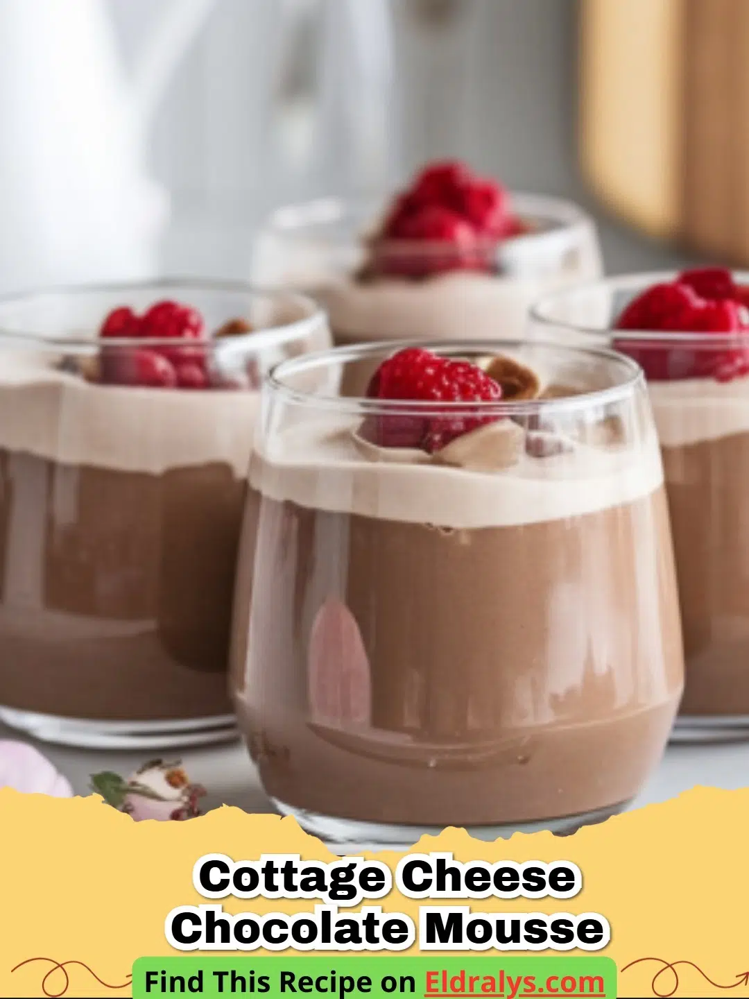 A close-up shot of creamy High-Protein Chocolate Cottage Cheese Mousse in a glass jar topped with raspberries.