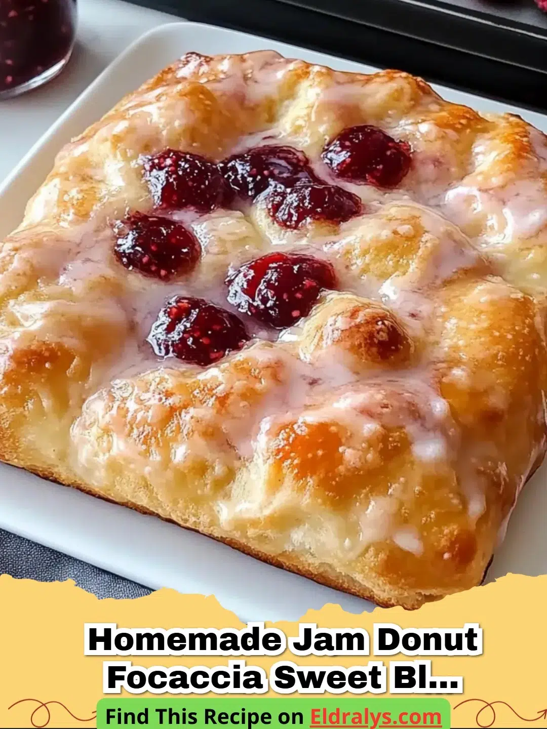 Golden brown Homemade Jam Donut Focaccia topped with white glaze and raspberry jam pockets
