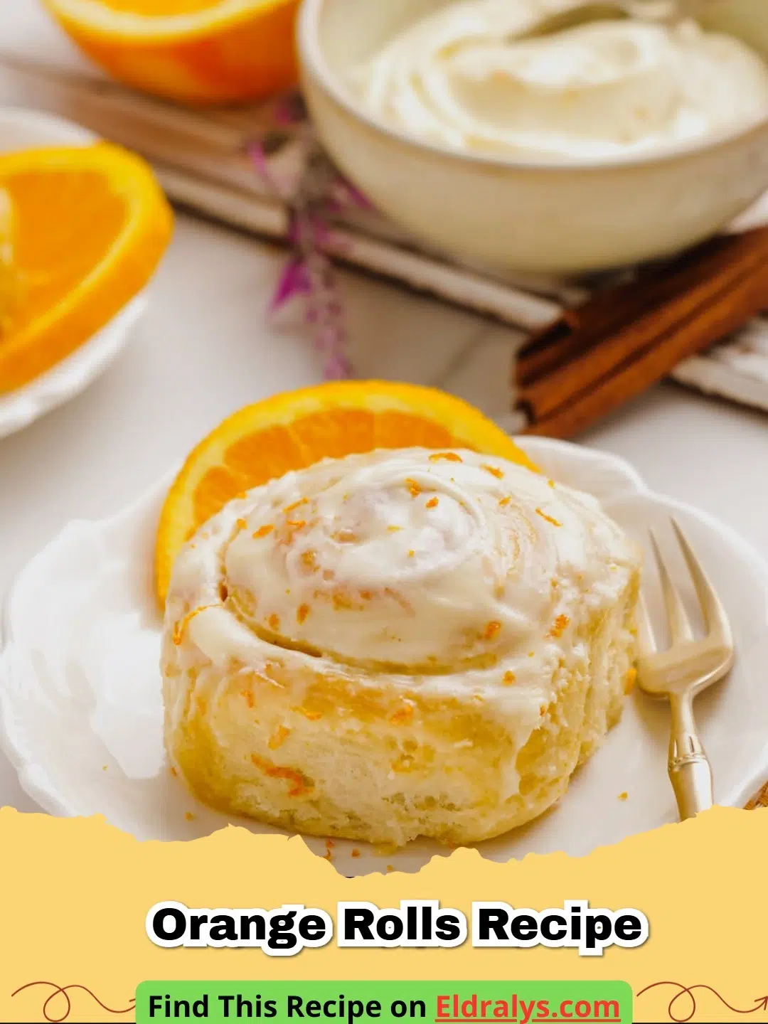 A tray of fluffy Homemade Orange Rolls with Cream Cheese Frosting with citrus zest on top.