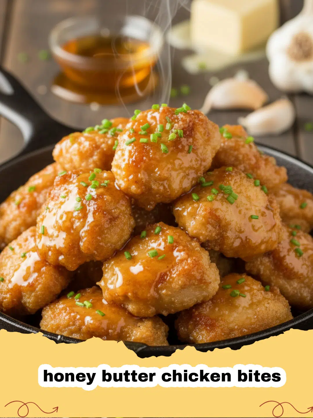 Close up of crispy honey butter chicken bites in a pan with parsley garnish
