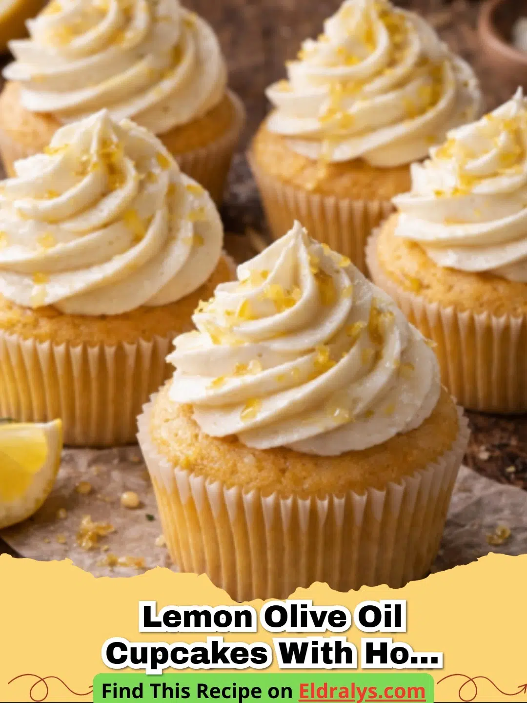 Lemon Olive Oil Cupcakes with Honey Mascarpone Frosting - Close up of a Lemon Olive Oil Cupcake with a swirl of Honey Mascarpone Frosting and lemon zest.