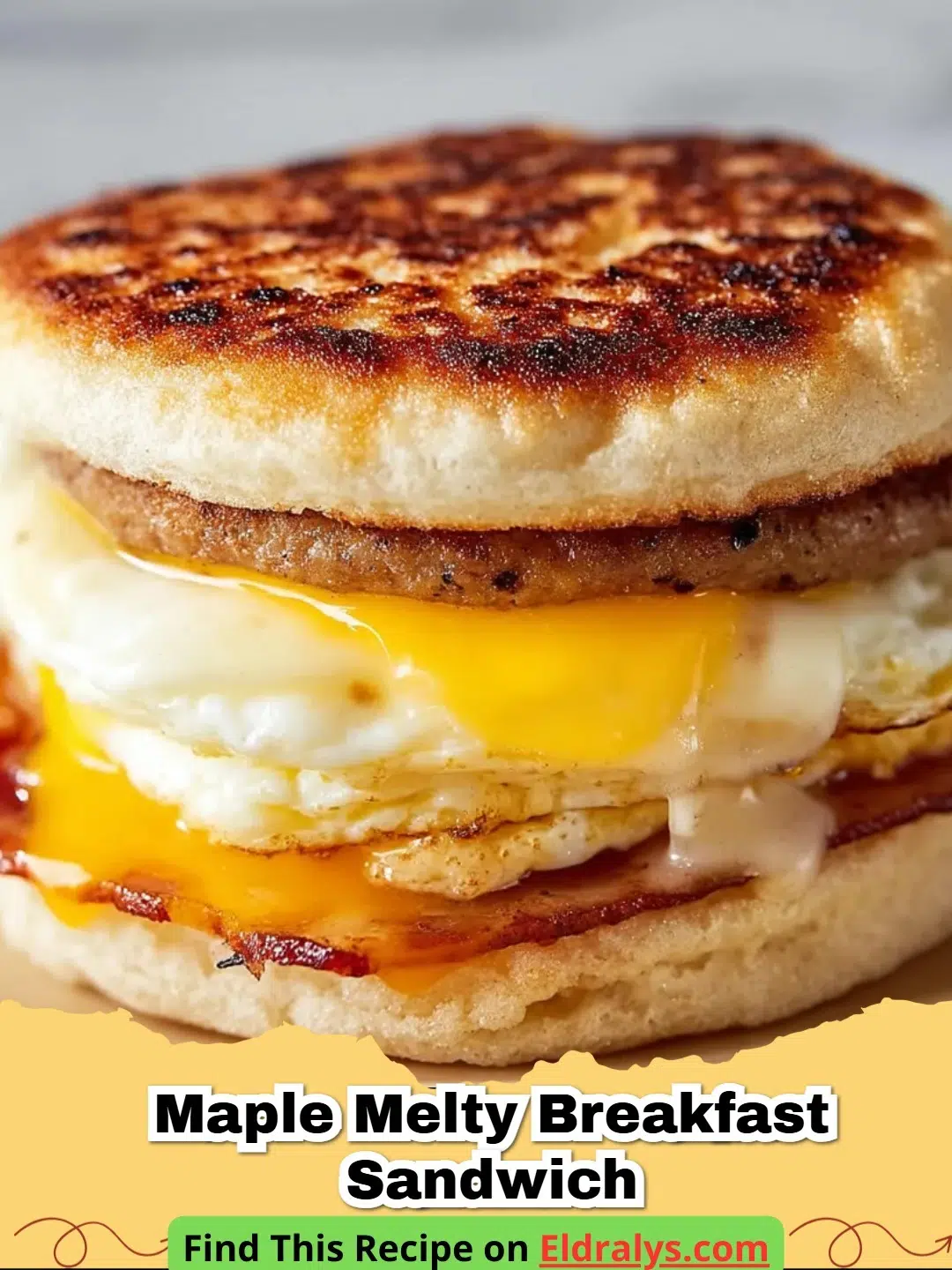 A close up of a Maple Bacon Egg and Cheese Breakfast Sandwich with melting cheese and glazed bacon.